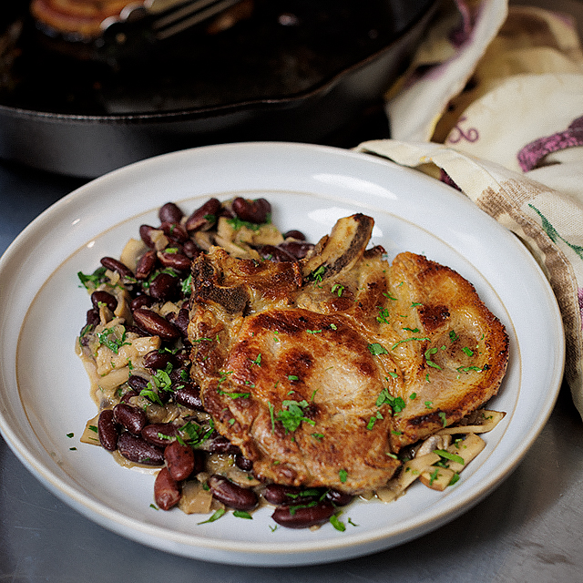 Gourmet Pork Chops on a Bed of Hearty Kidney Beans Stew