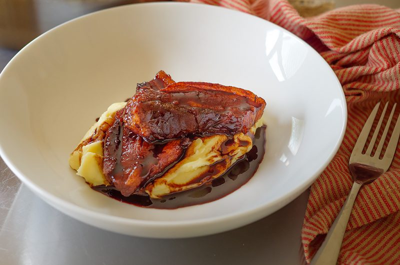 Savory Braised Pork Belly with Irish-Inspired Potato Purée and Red Wine Drizzle