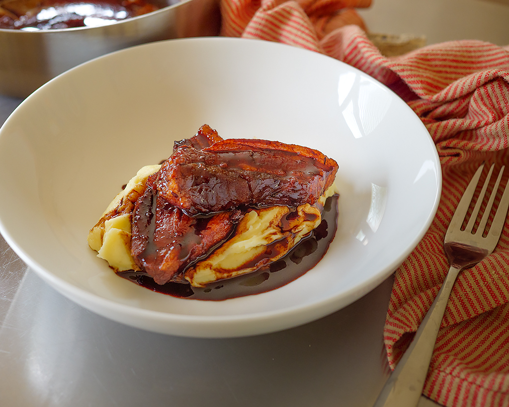 Savory Braised Pork Belly with Irish-Inspired Potato Purée and Red Wine Drizzle